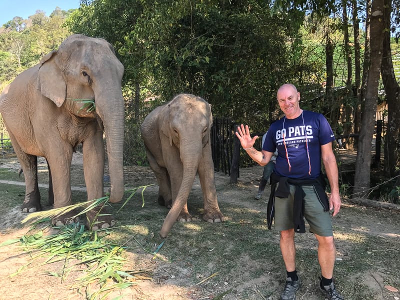 Steve with two elephants at a sanctuary in Thailand